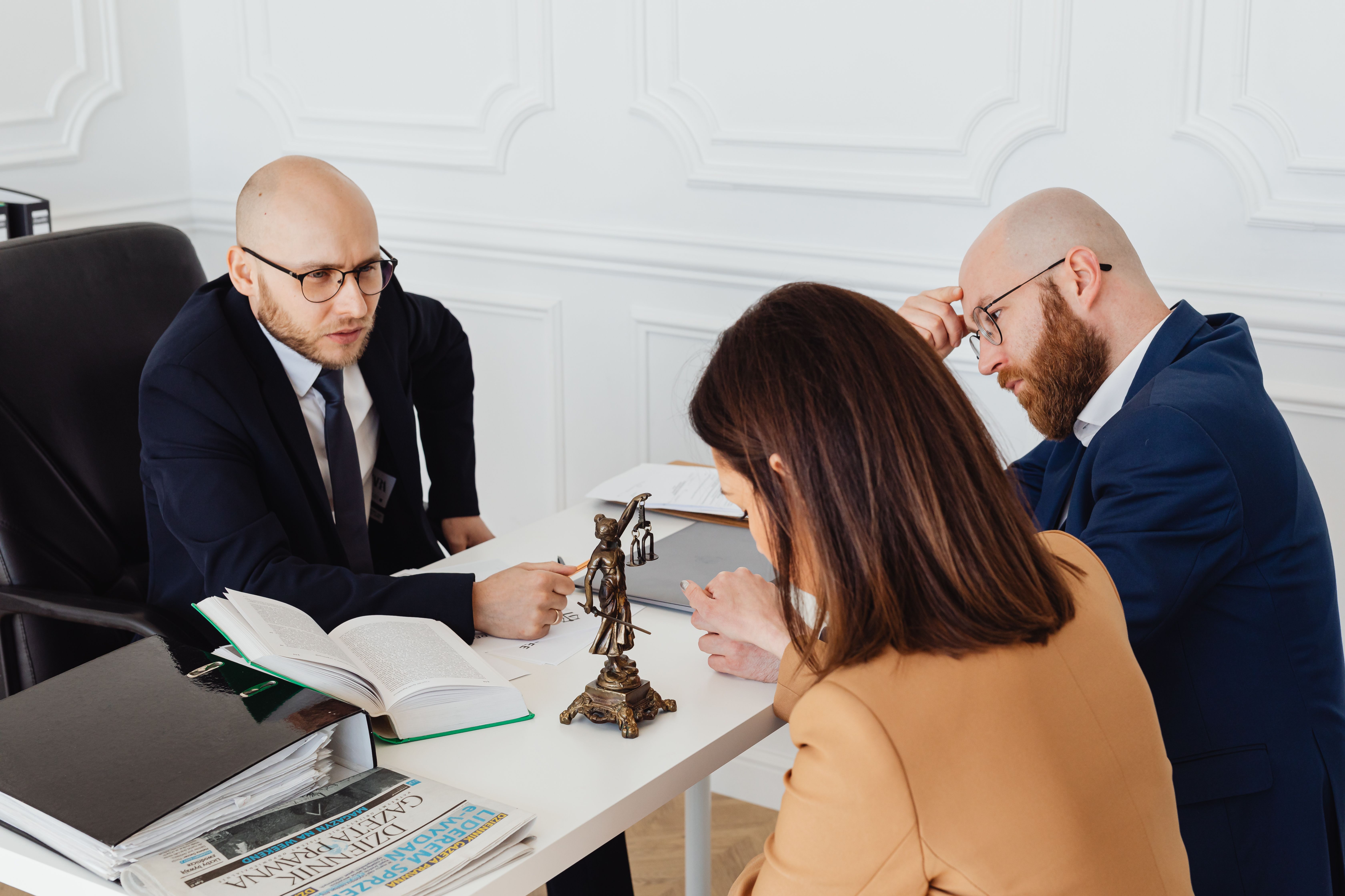 Lawyer consulting a client in a modern office, representing who uses third-party litigation funding